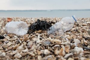Plastic bottles on a stony beach