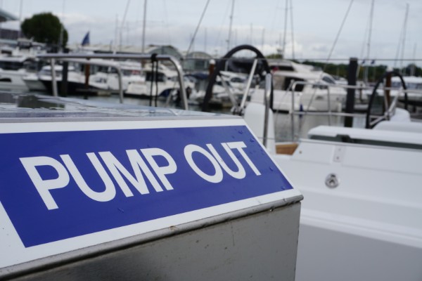 A pump out station sign in a marina