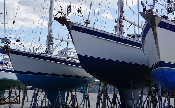 Landscape of yachts in a line on chocks in a marina boat yard