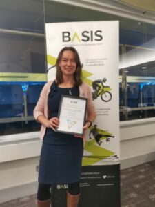 Kate Fortnam accepting her BASIS Award