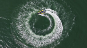 Aerial view of a rib driving in a circle