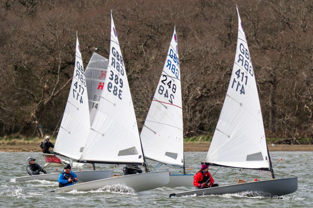 Four dinghies sailing on the water