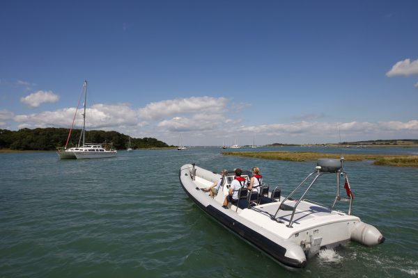Powerboat and catamaran on the water in a coastal estuary